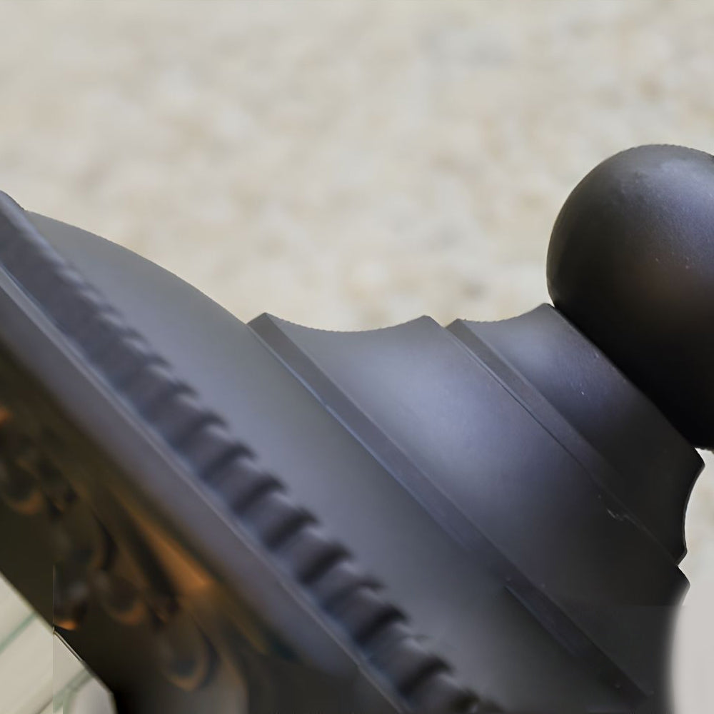 Detailed view of black metal mounting bracket and decorative elements of traditional outdoor wall lantern