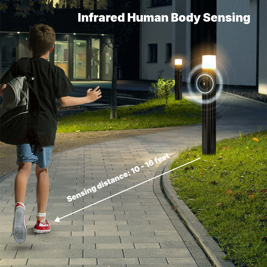 Pair of black solar post lights with motion sensors installed on concrete pathway