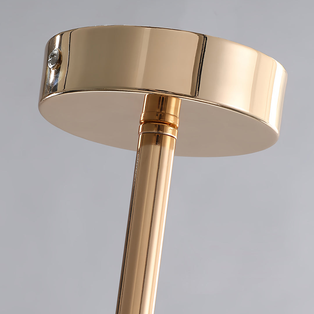 Detailed view of the polished gold ceiling canopy and rod structure for the clear glass flush mount ceiling light.