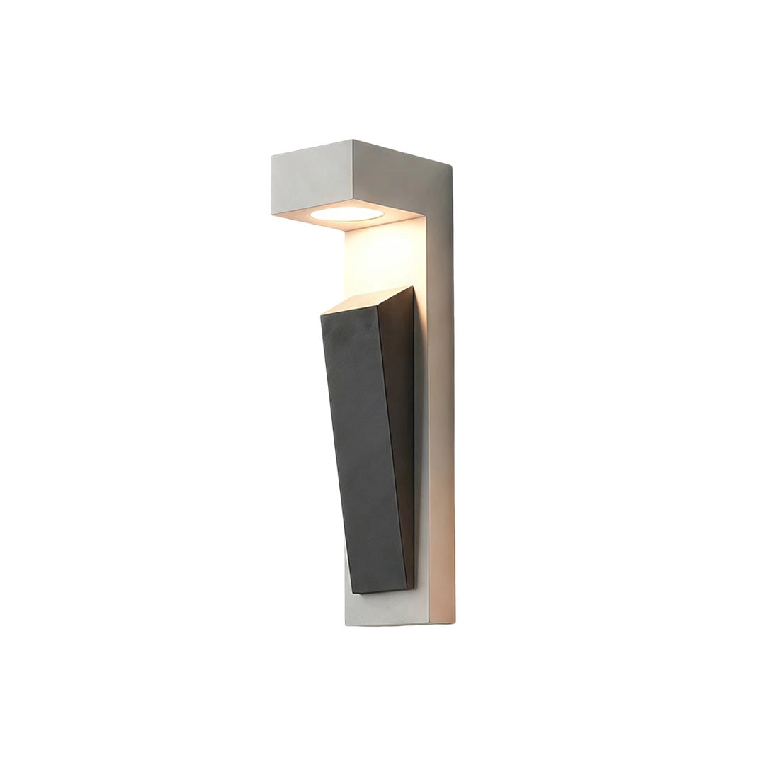 Modern outdoor wall light in a light stone finish isolated on a white background.