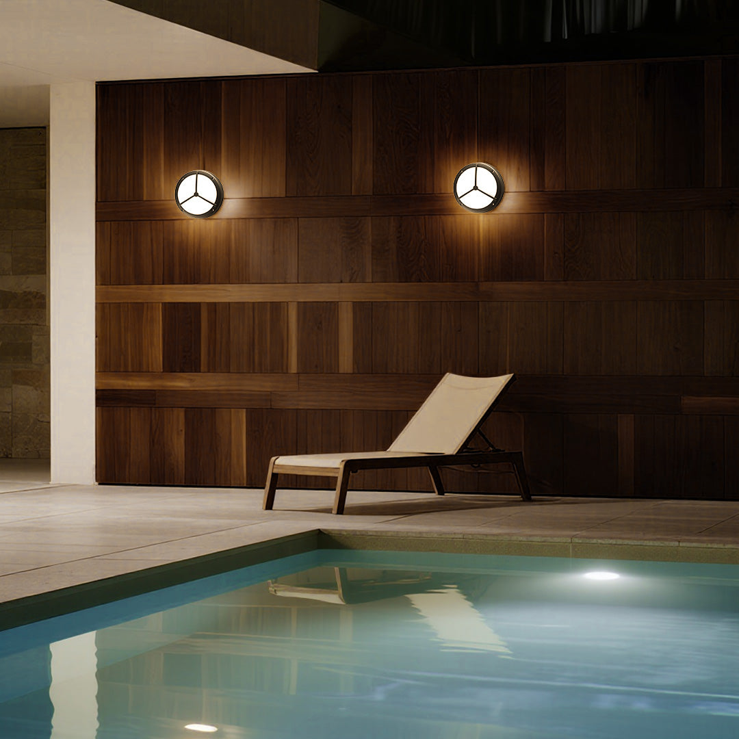Pair of waterproof outdoor wall lightings illuminating wooden garage doors beside indoor pool
