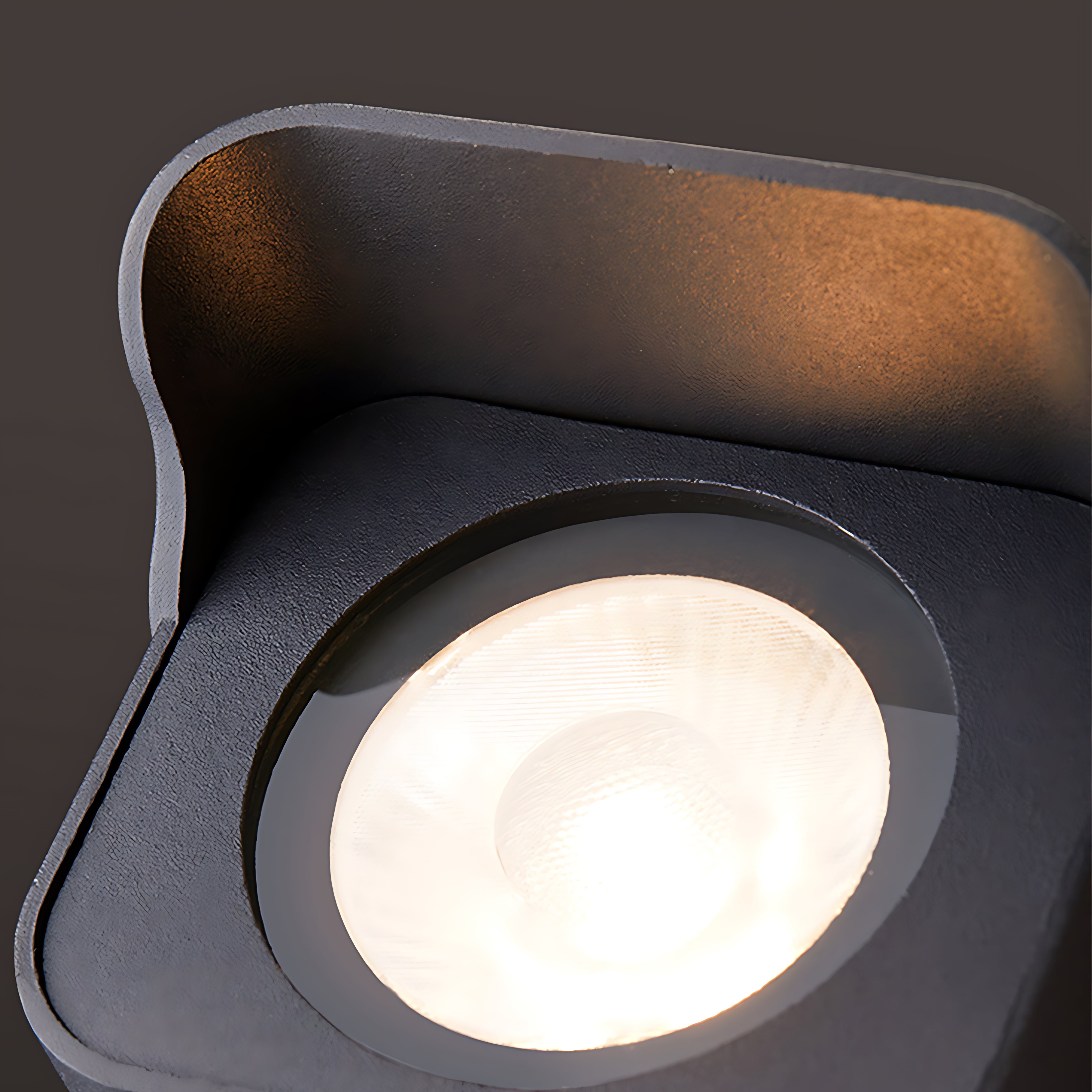 Close-up detail of LED spotlight showing bright white light output and housing design