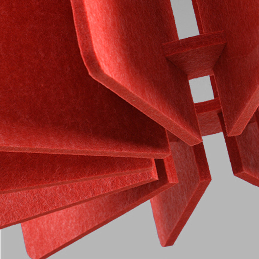 Abstract texture shot of thick red felt material components used to construct a decorative 1 light single pendant lamp.