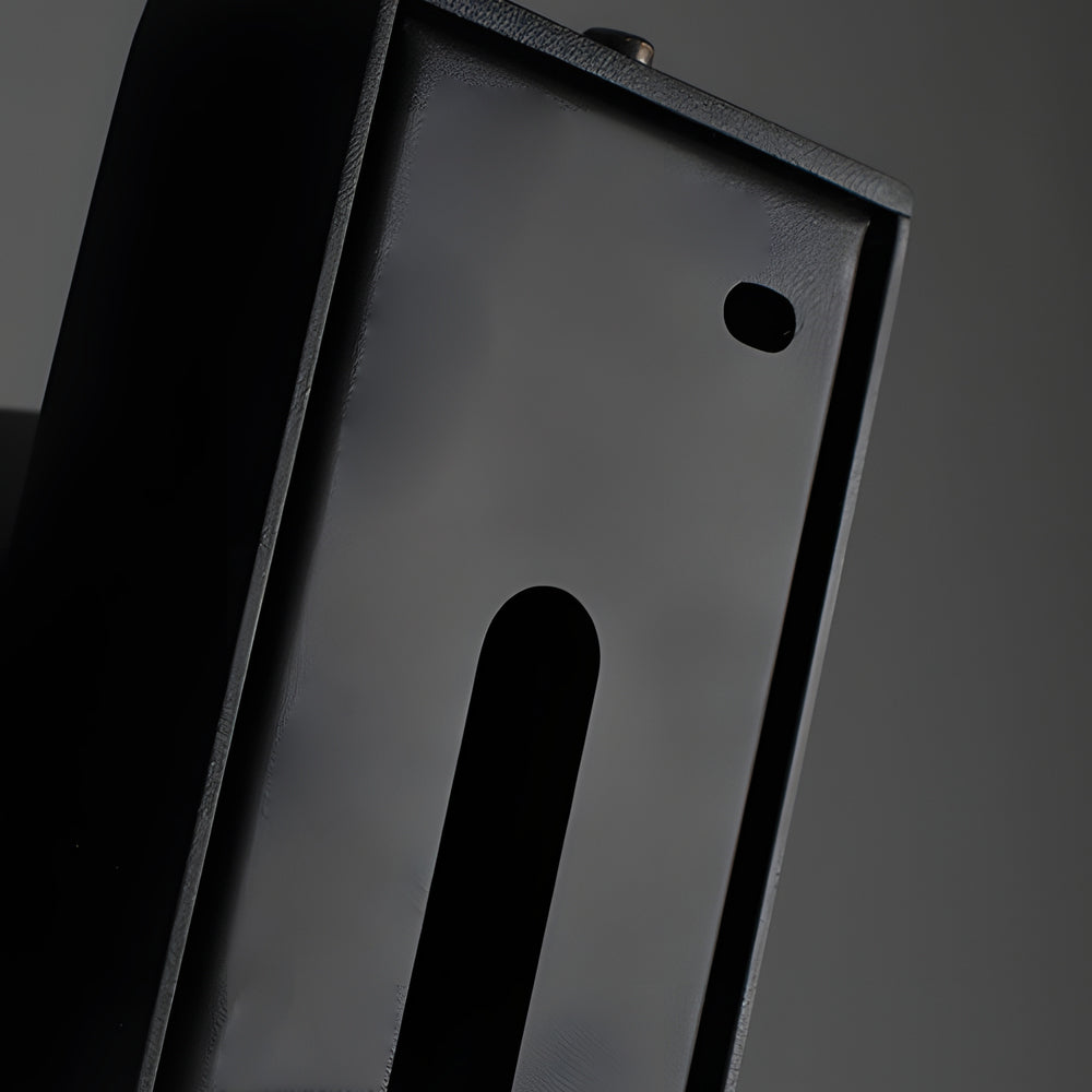 Accent wall lamp backplate and mounting detail close-up.