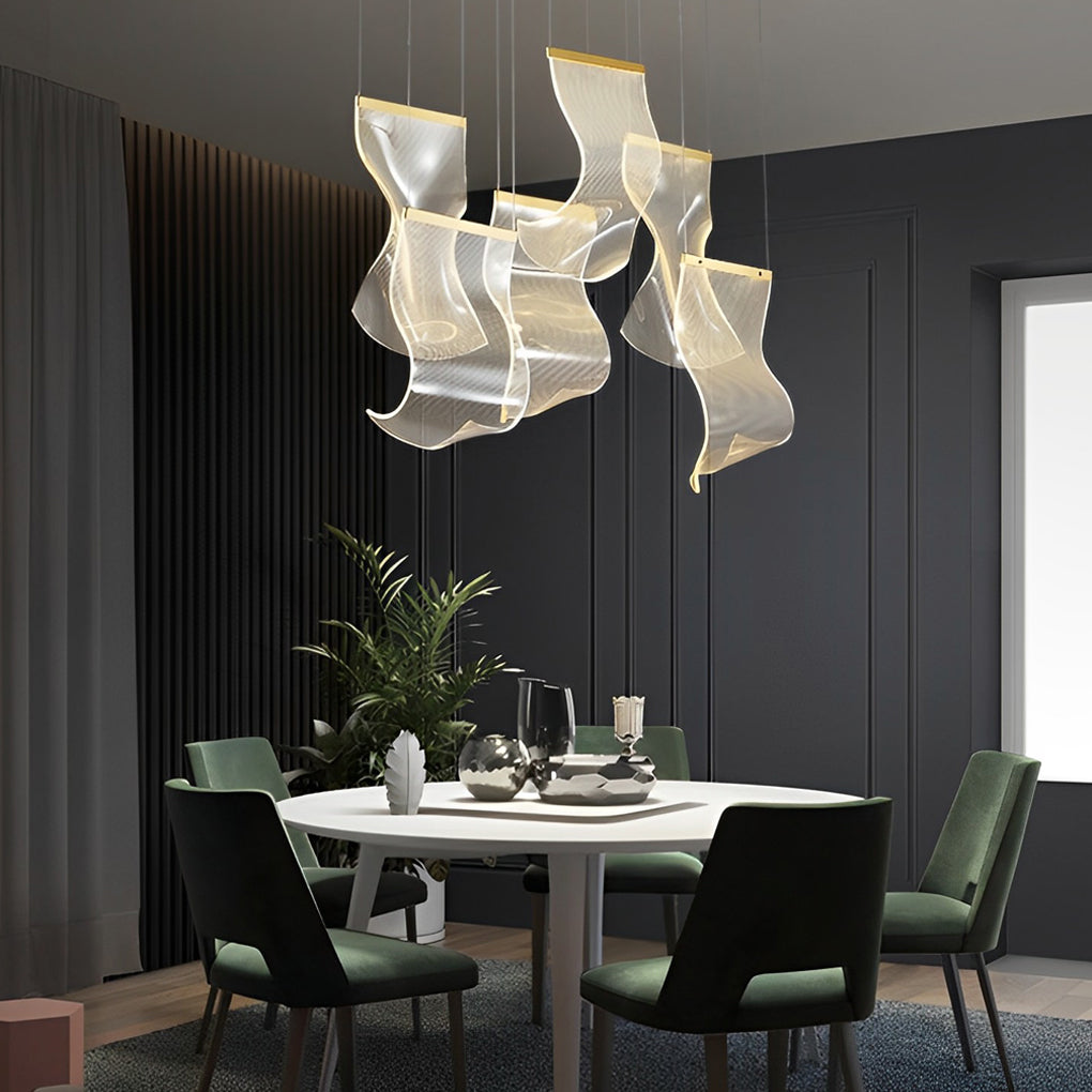Acrylic chandeliers with a black and gold finish, enhancing a modern interior.