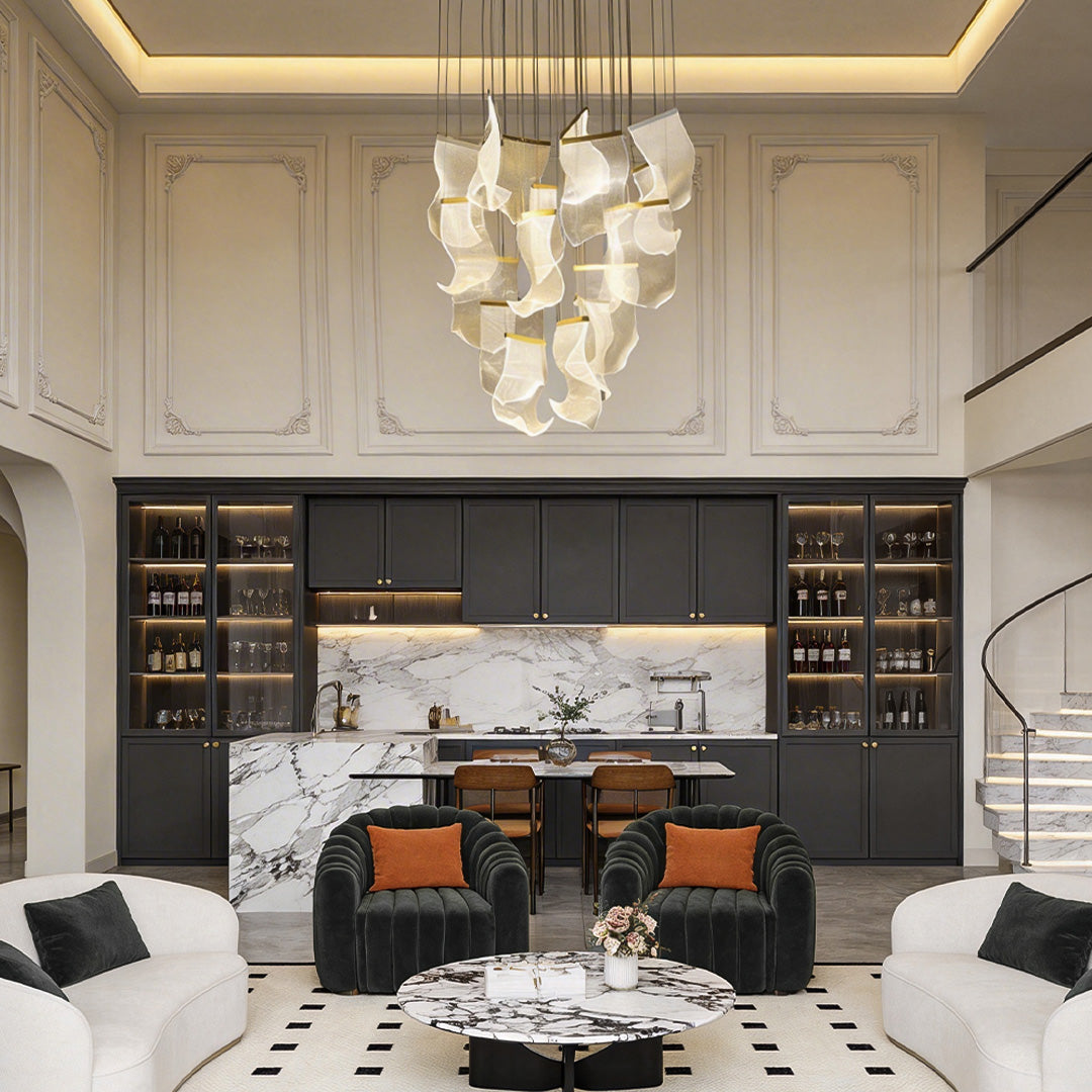 Acrylic chandeliers providing elegant illumination in a contemporary kitchen.