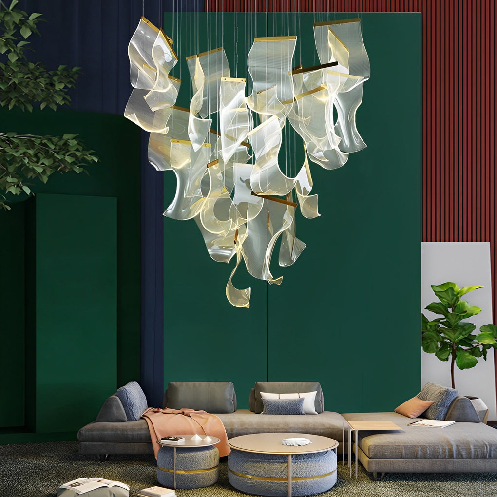 Acrylic chandeliers with a modern design, hanging above a dining table.