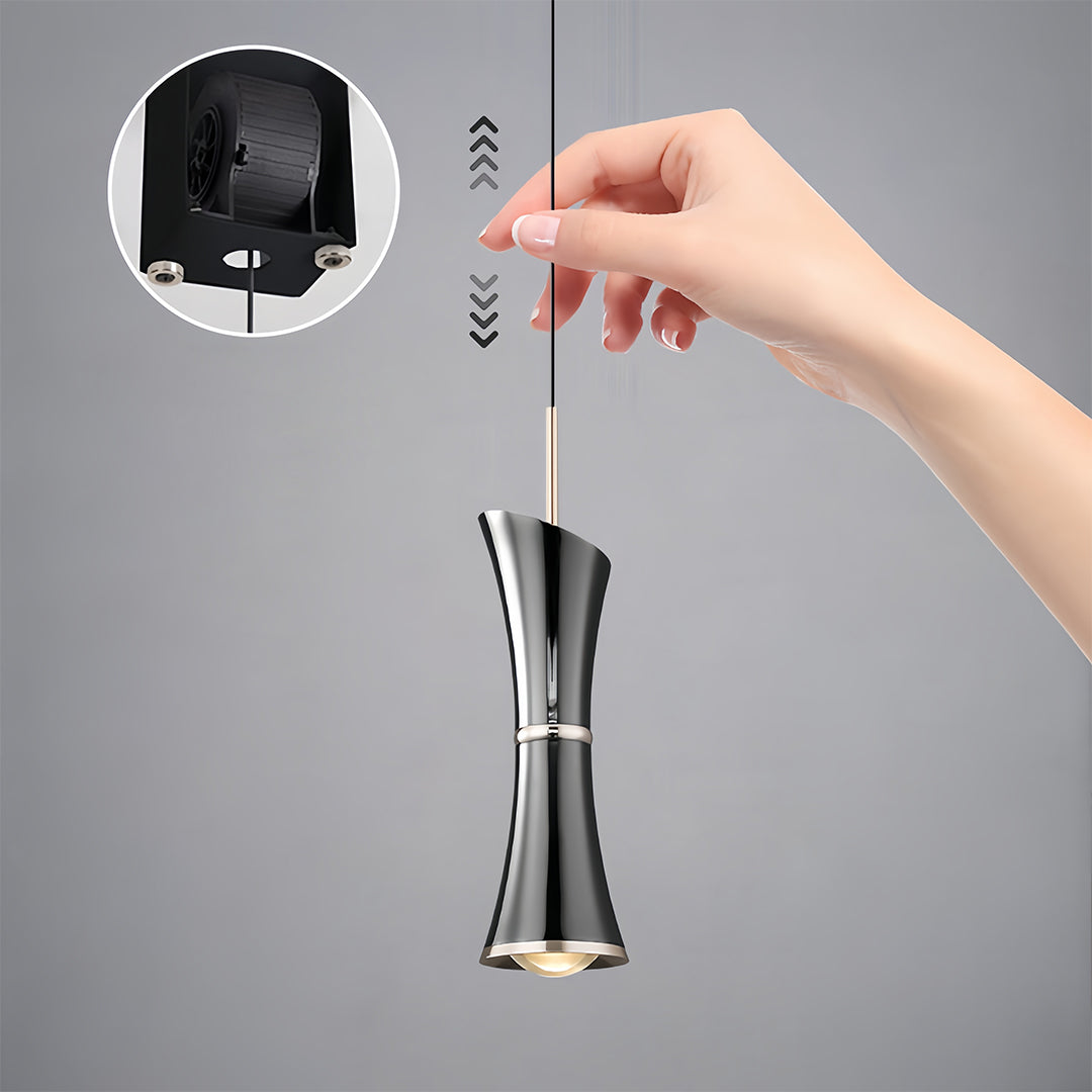 Small black pendant light with adjustable cord length demonstrated by hand positioning