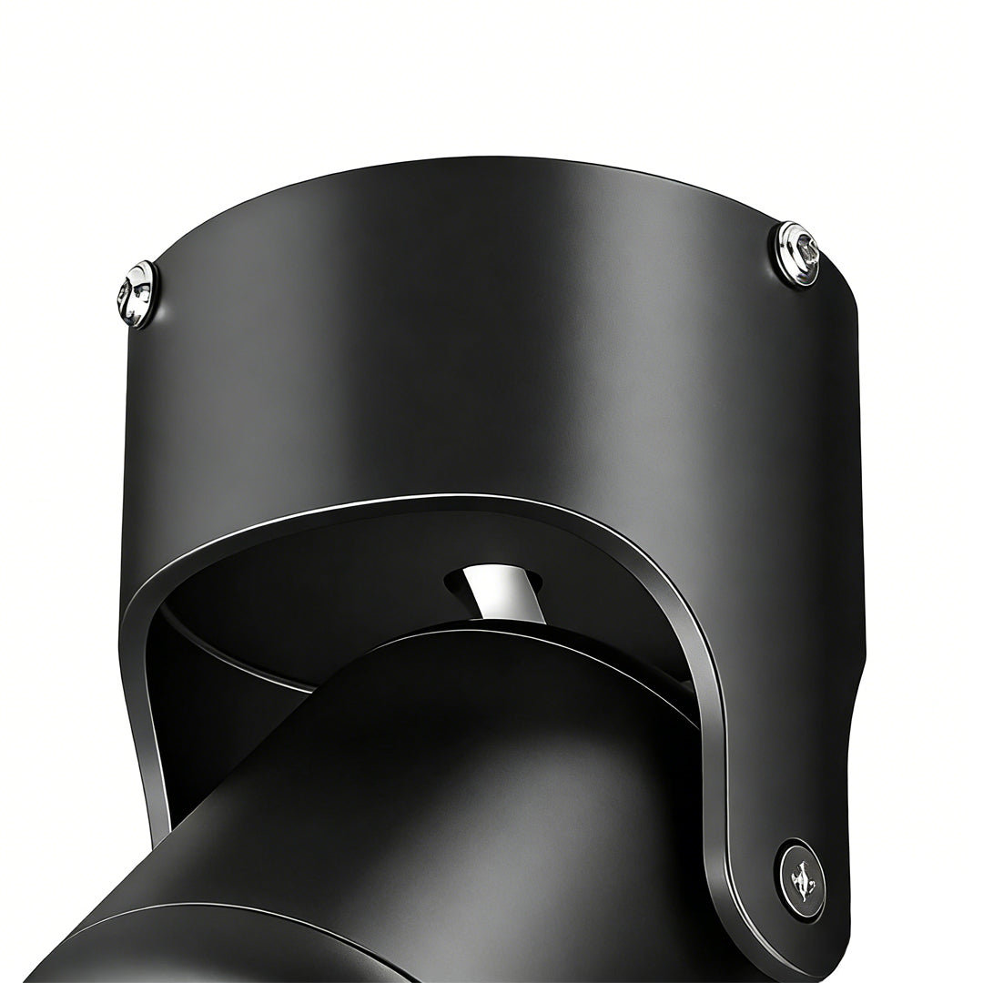 Adjustable downlights with a black finish, providing focused lighting in a bedroom.