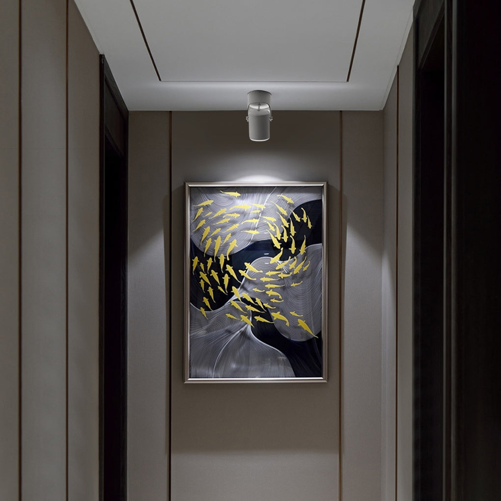 Adjustable downlights with a modern design, installed in a minimalist dining room.