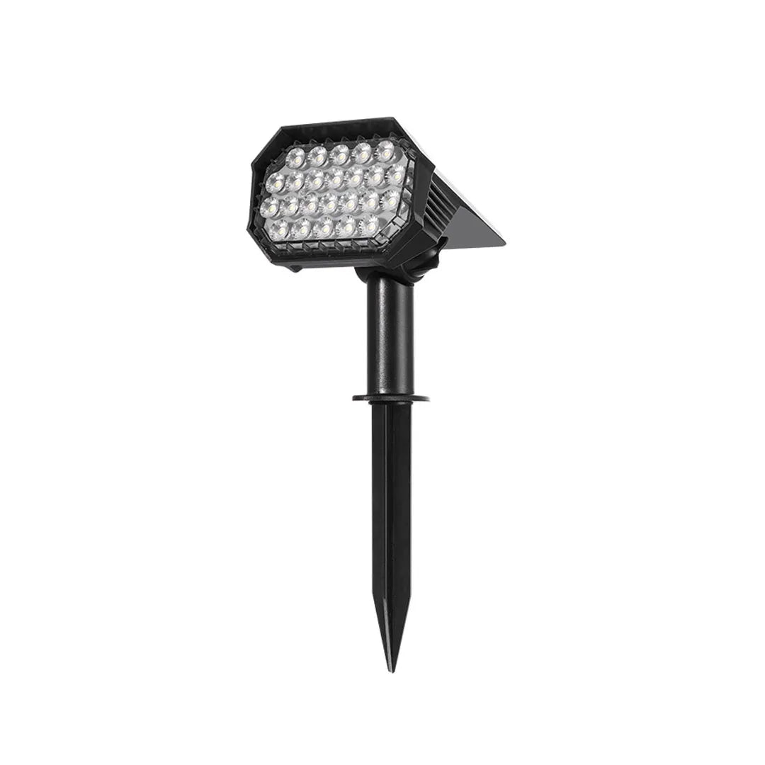 Garden stake solar lights with a black adjustable spotlight head and pointed ground stake on white background.
