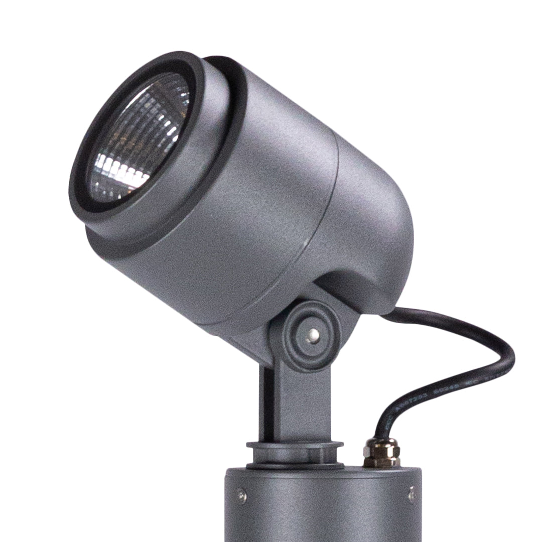 Adjustable gray LED spotlight fixture with directional head for outdoor accent and security lighting