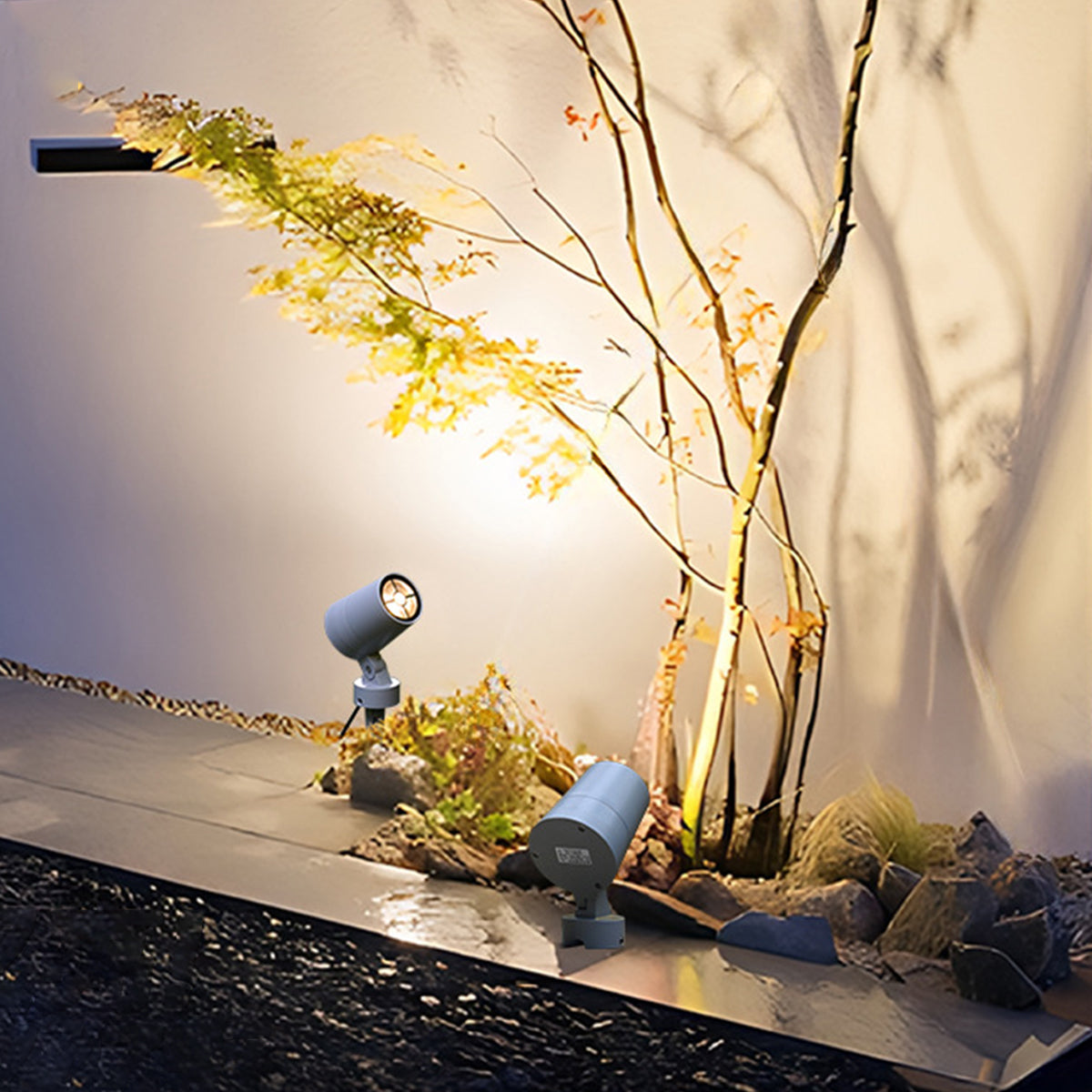 Adjustable outdoor spotlight with ground spike mounting system for garden accent lighting