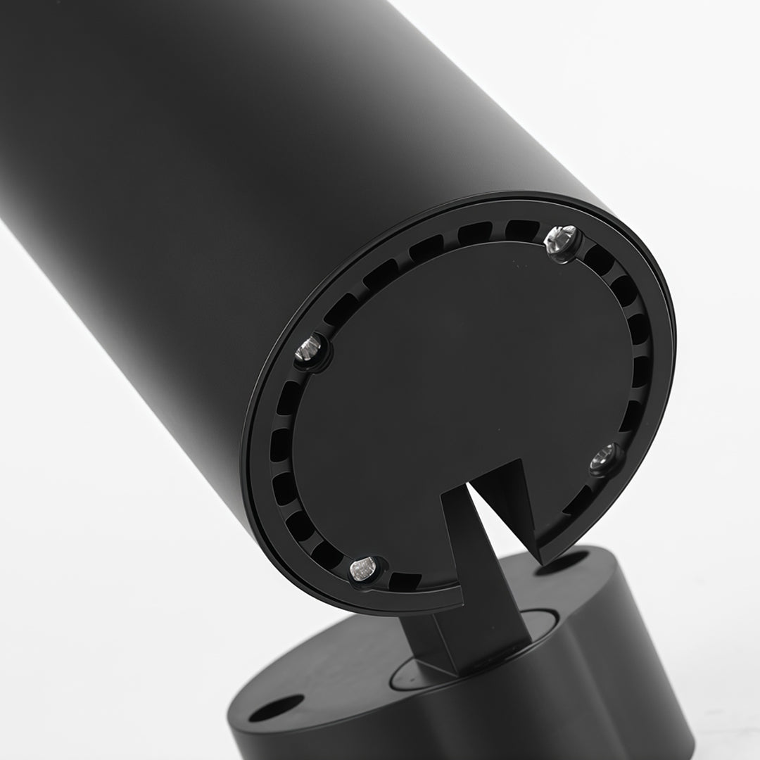 Close-up detail of adjustable LED can lights featuring black cylindrical housing and precision spotlight head.