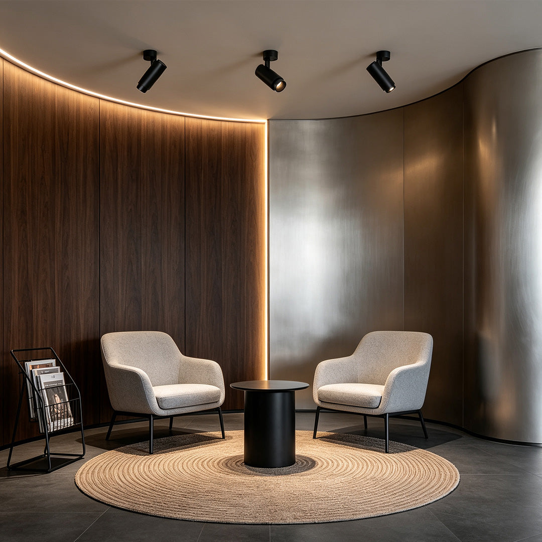 Contemporary adjustable LED can lights creating warm ambient lighting in a stylish lounge interior.
