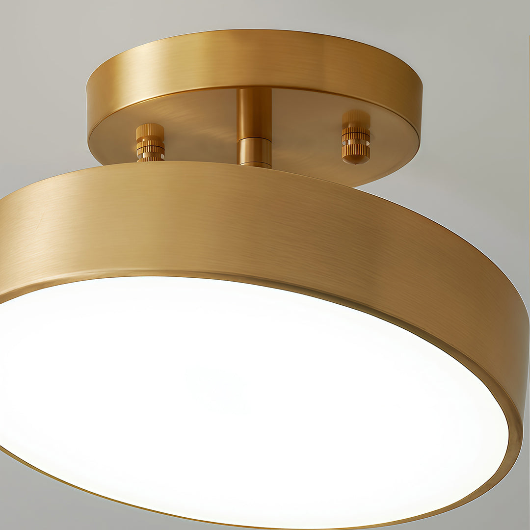 Gold adjustable LED ceiling light isolated on a white background.