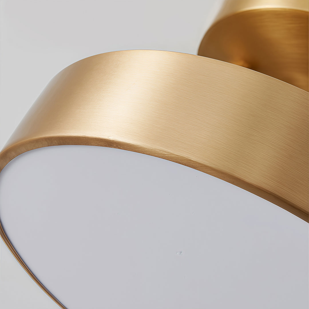 Textured finish detail of an adjustable LED ceiling light in gold.