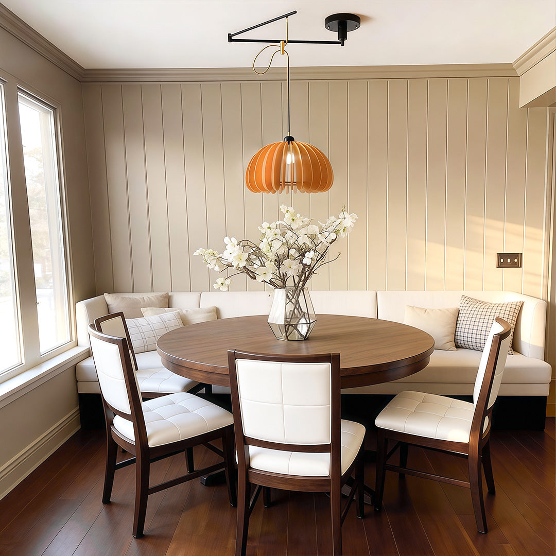 Adjustable pendant light fixture hanging above a dining room table