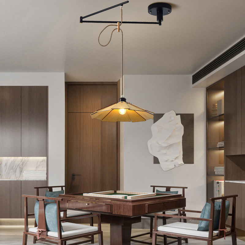 Adjustable pendant light fixture in a modern dining space