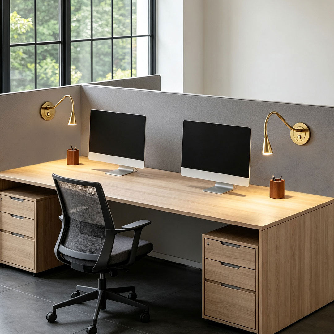 Adjustable wall light with swing arm for modern office workstation lighting.
