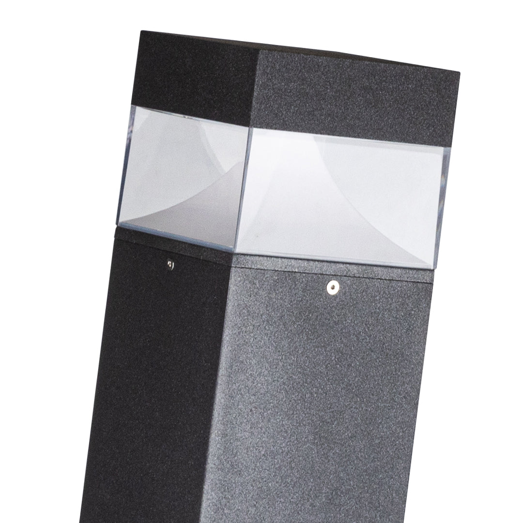 Square bollard with alternating dark and light horizontal sections for accent lighting