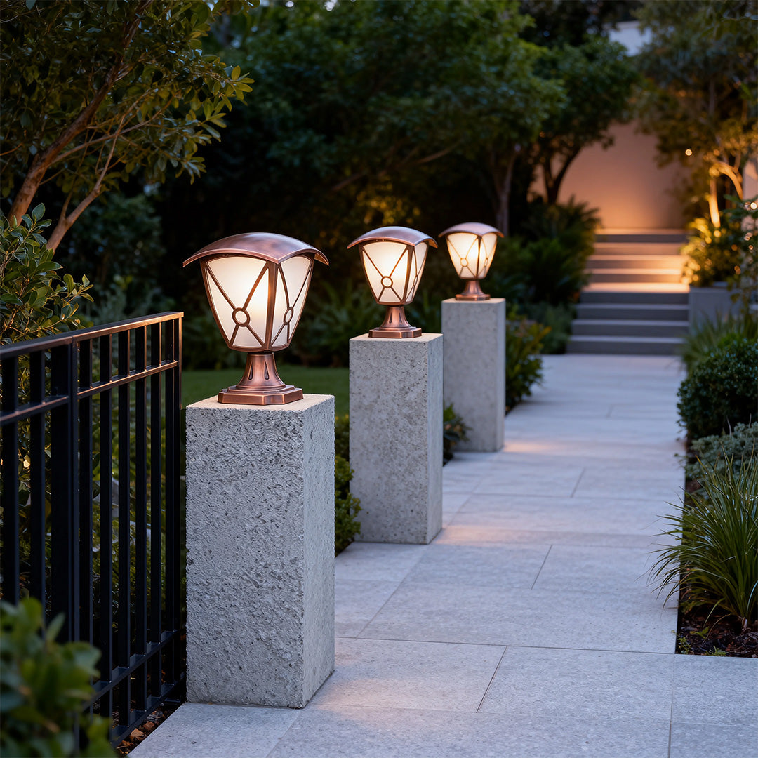 Multiple aluminum pillar light brightening concrete pillars along modern walkway at evening