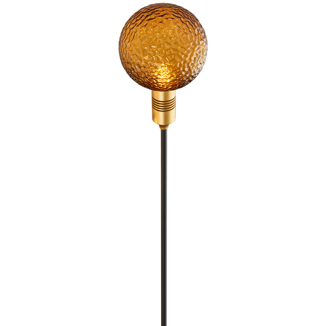 Bright amber crackle-glass globe light mounted on a slim stake for stylish path landscape lighting.