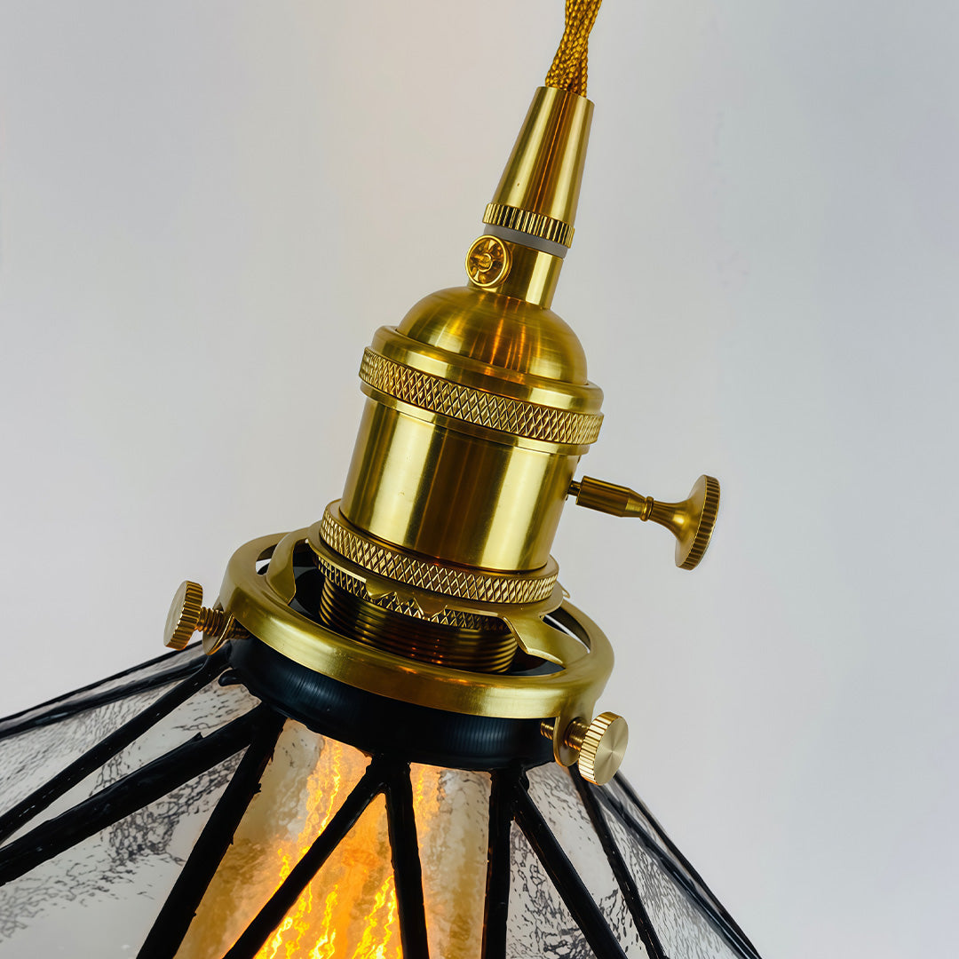 Amber indoor pendant light in brass, front view of the vintage design.