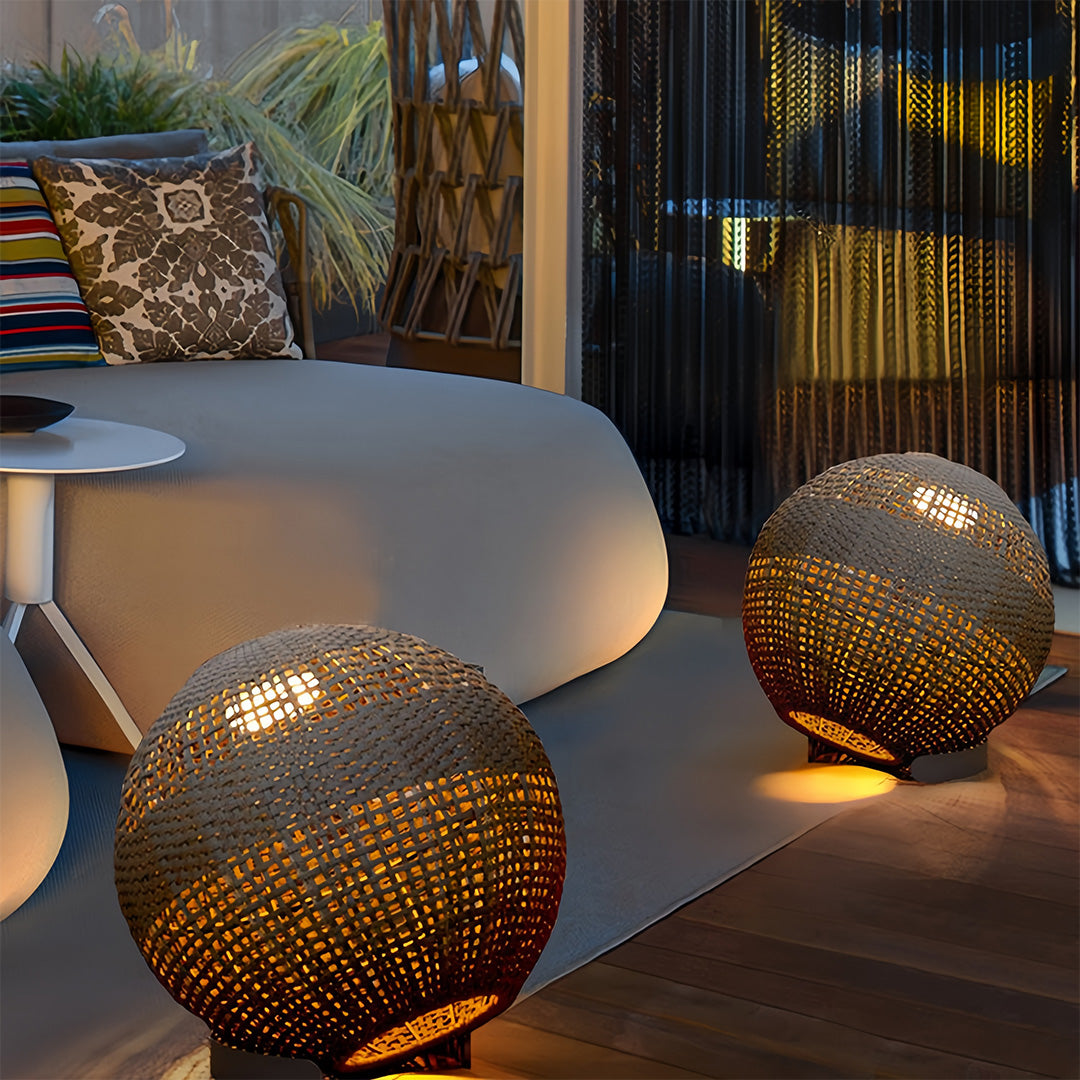 Ambient outdoor globe lantern lights nestled by a modular outdoor sofa, creating a cozy evening living space.