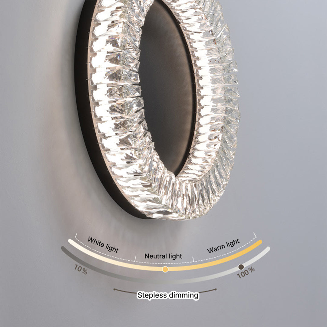 Angled view of black ceiling flush mount light showing crystal detail and circular profile on white surface.