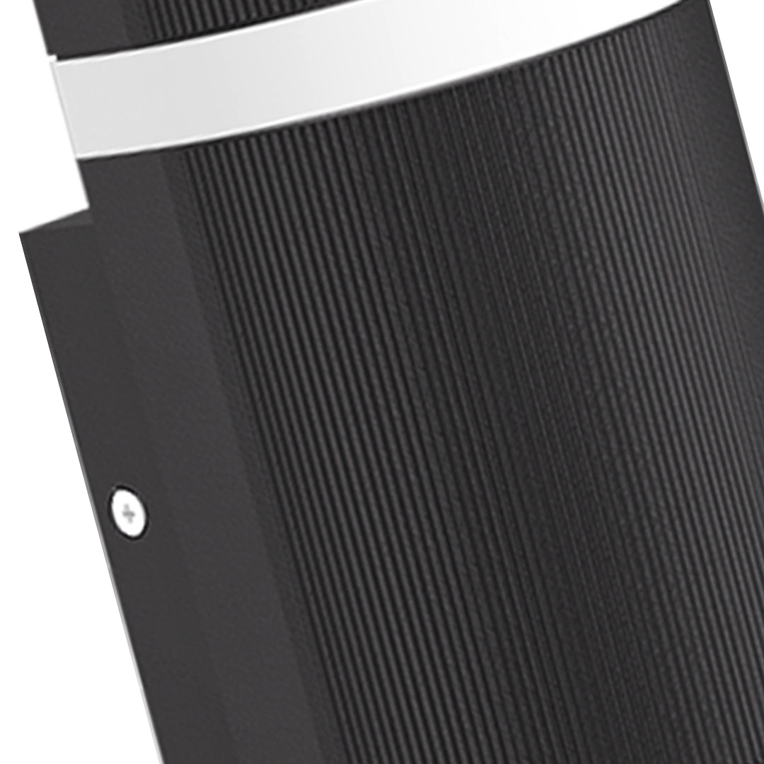 Angled black garden wall light fixture with textured surface on white background