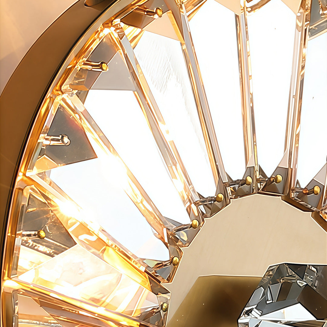 Close-up of crystal light wall featuring glass shade chandelier styling highlighting circular crystal disc and starburst metal construction.