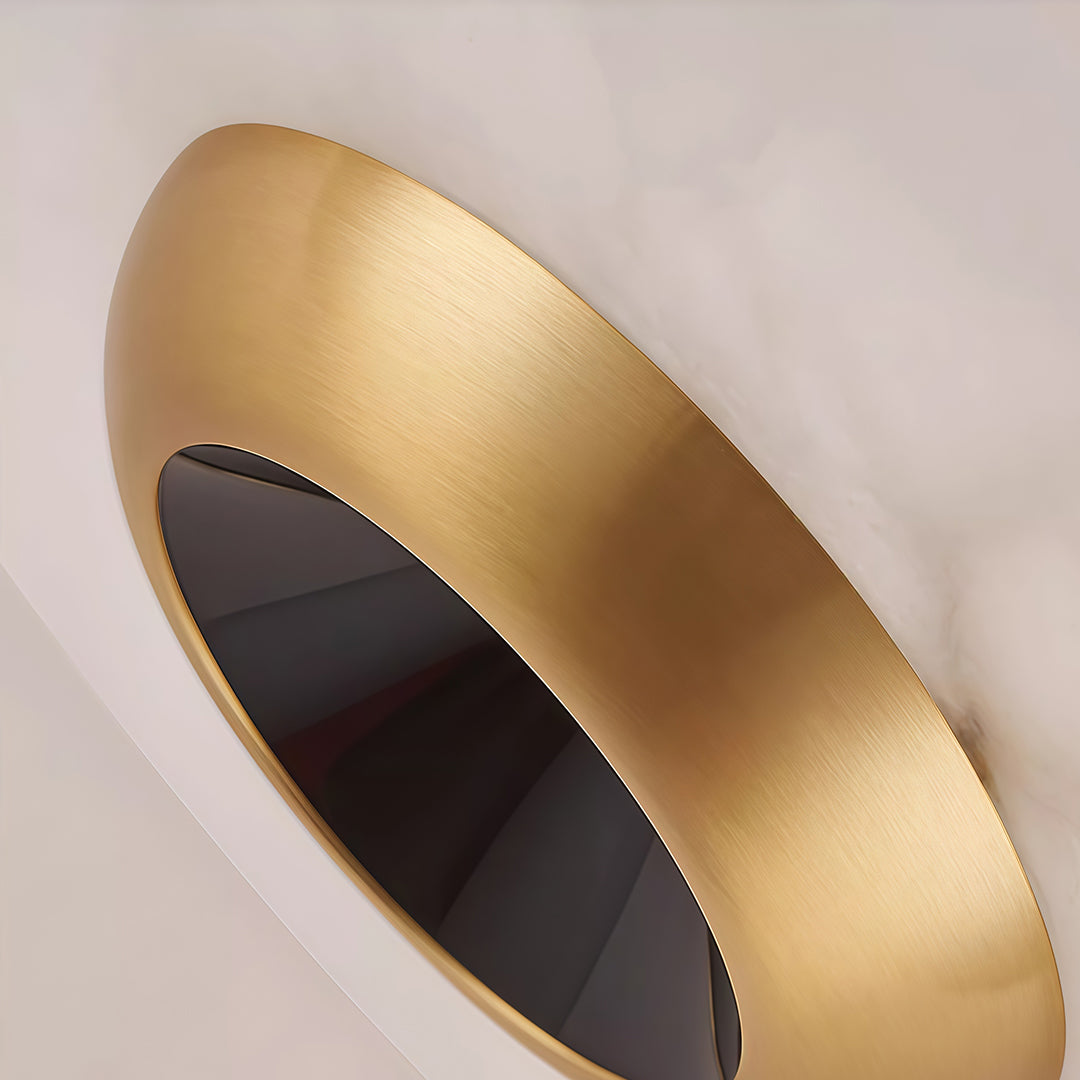 Angled detail of modern LED pendant lights featuring glass shade chandelier styling highlighting gold exterior and black interior cone.