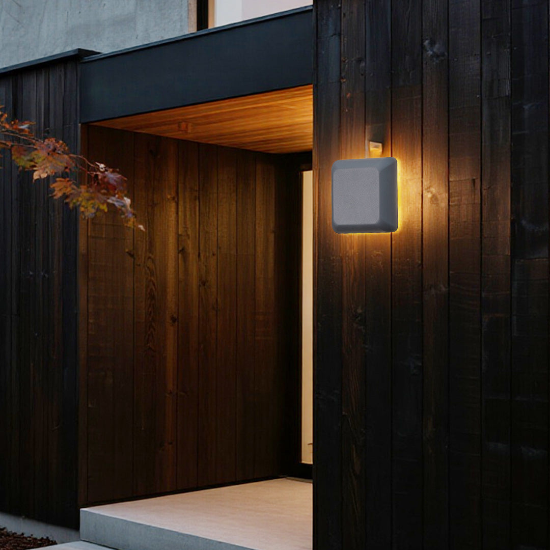 Angled view of modern waterproof outdoor wall light showing dimensional profile on white background