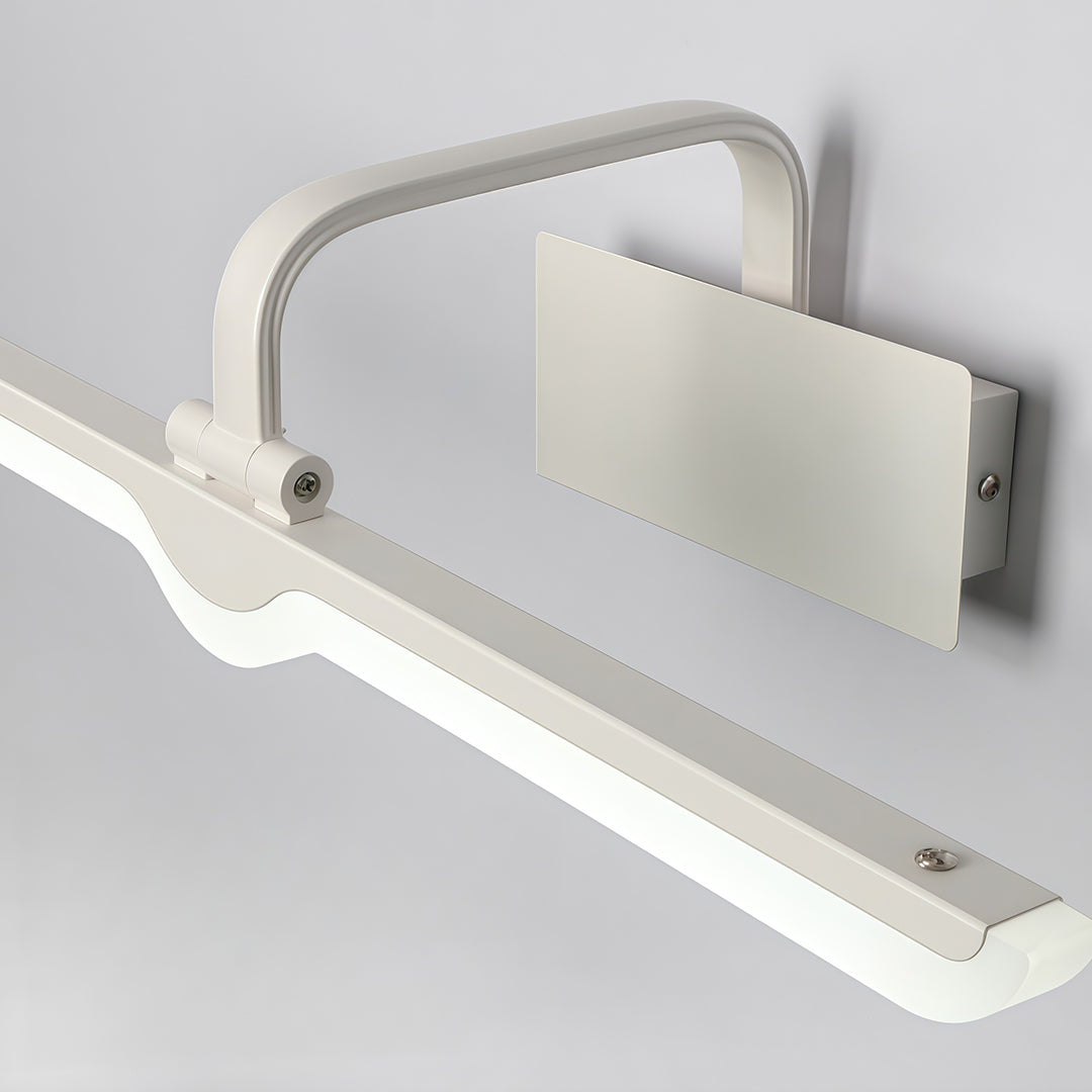 Angled view of white bathroom vanity light displaying wave design and LED strip detail.