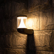 Modern black curved outdoor wall light with integrated LED and sleek geometric design