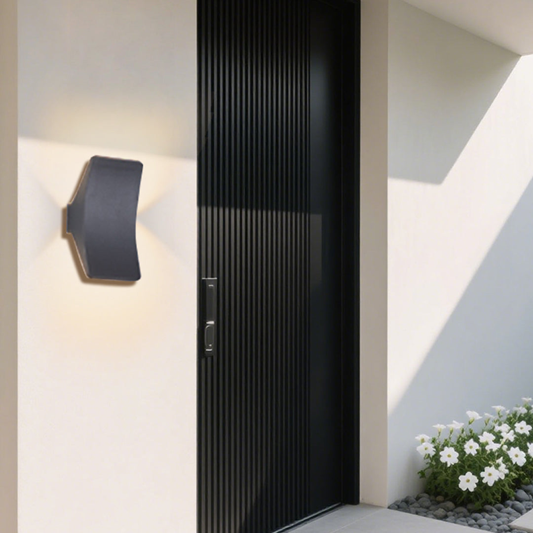 Illuminated entrance way with modern recessed lighting and glass door panels in residential setting
