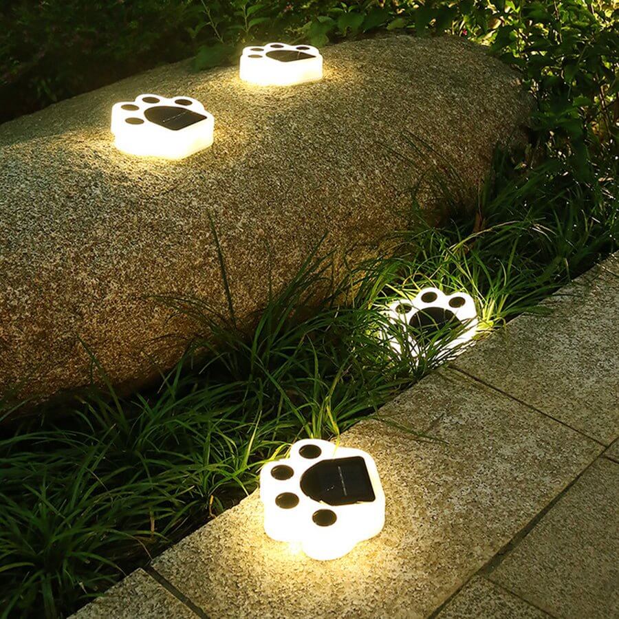 Animal paw step stairs light on a brick wall, providing subtle outdoor lighting.