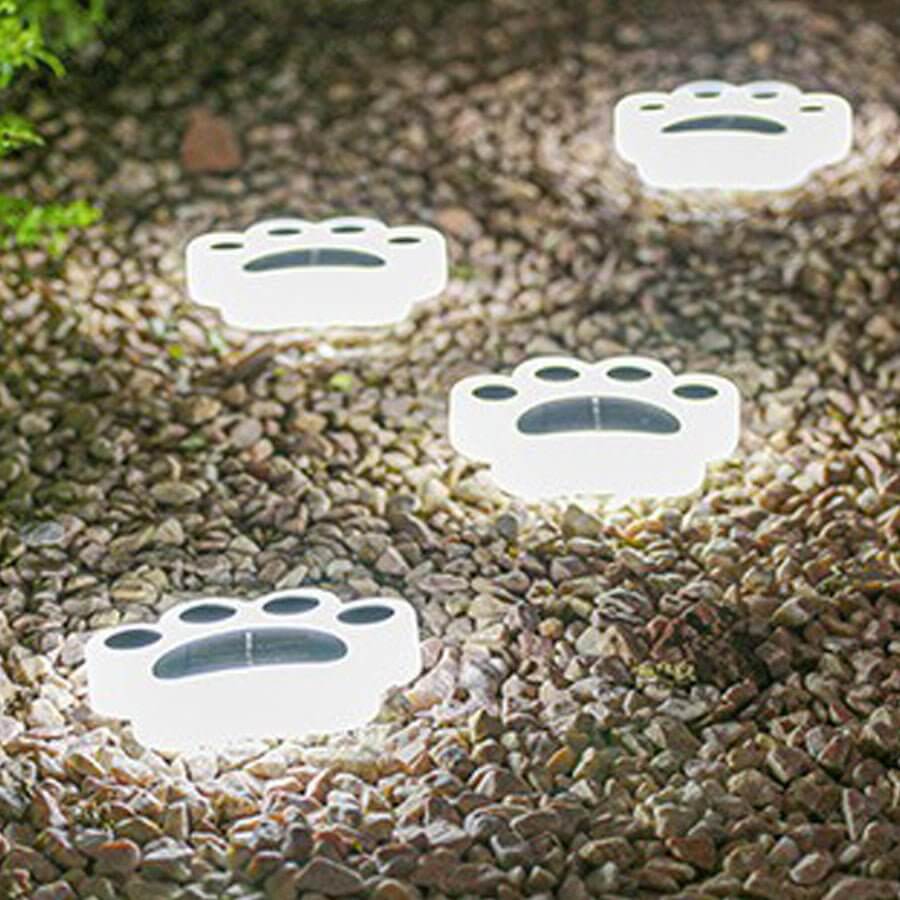 Animal paw step stairs light on a tiled wall, creating a cozy ambiance.