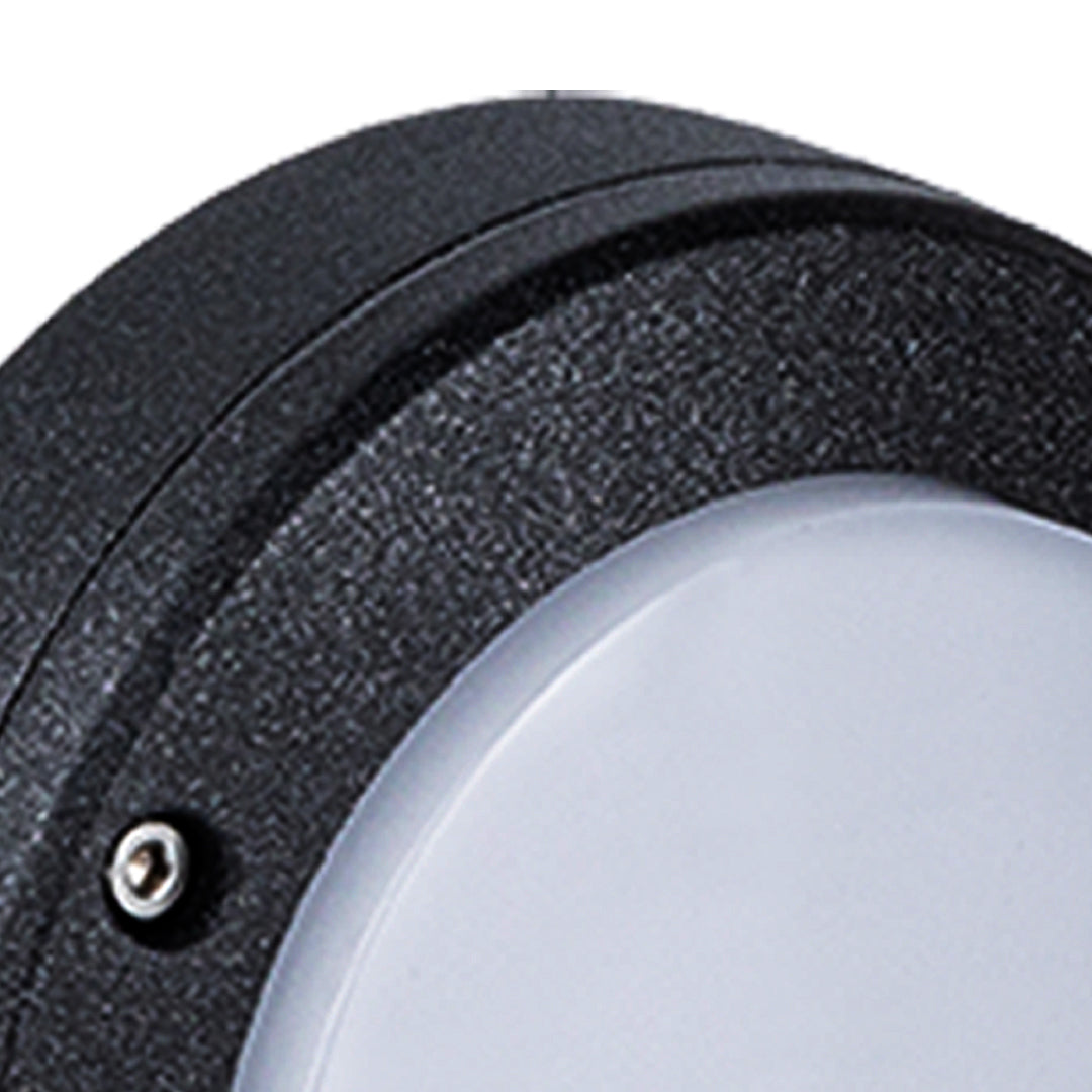 Detailed close-up of the anti-corrosion textured black finish on the frame of the round outdoor wall lights fixture.