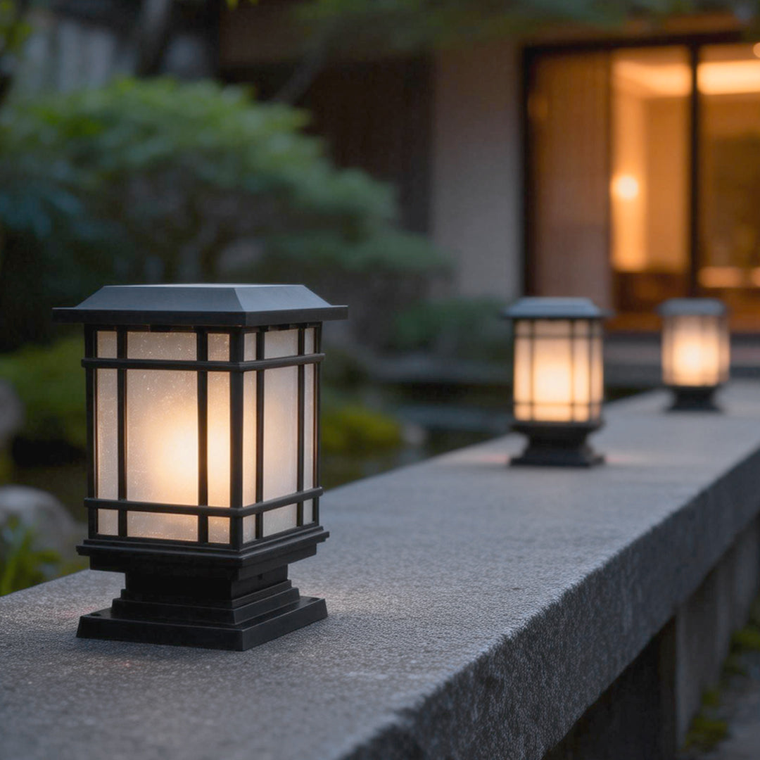 Antique cast iron street light with a warm glow, enhancing a modern outdoor staircase.