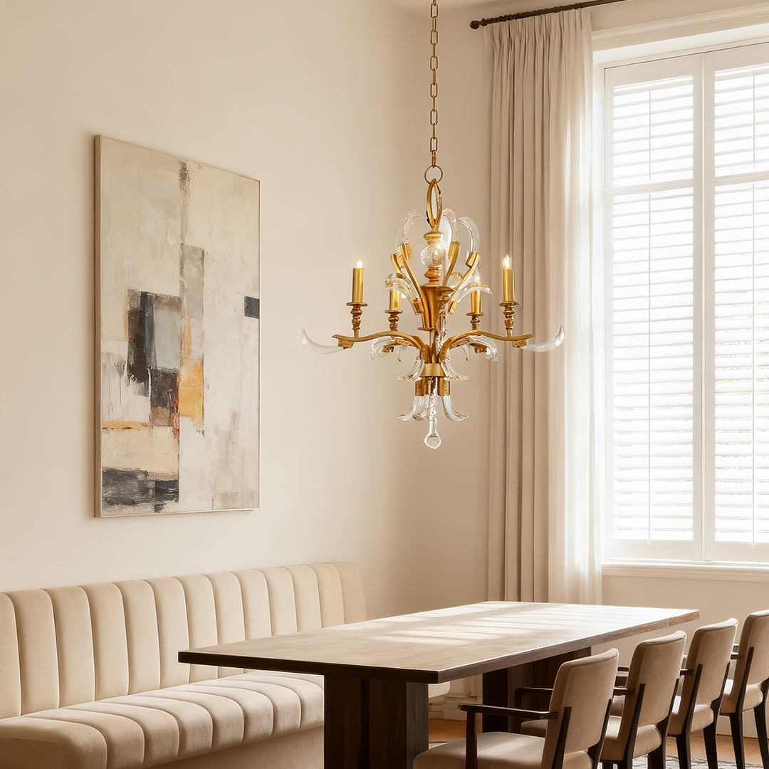 Gold and crystal chandelier product close-up, highlighting the antique gold finish, candle lights, and teardrop crystal pendants.