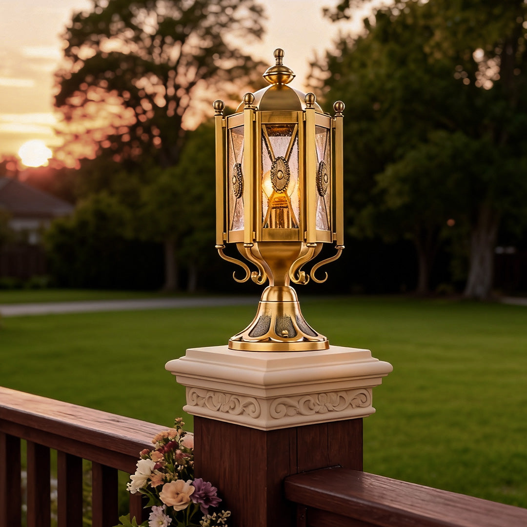 Antique-style vintage pillar lights on a brick pillar, providing a nostalgic glow to a garden pathway.