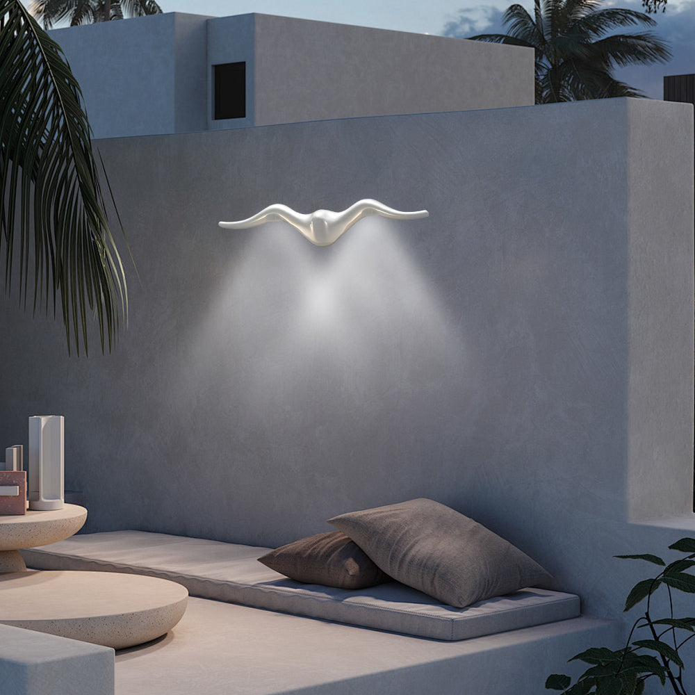 Architectural two light outdoor wall sconce producing dramatic upward and downward light beams
