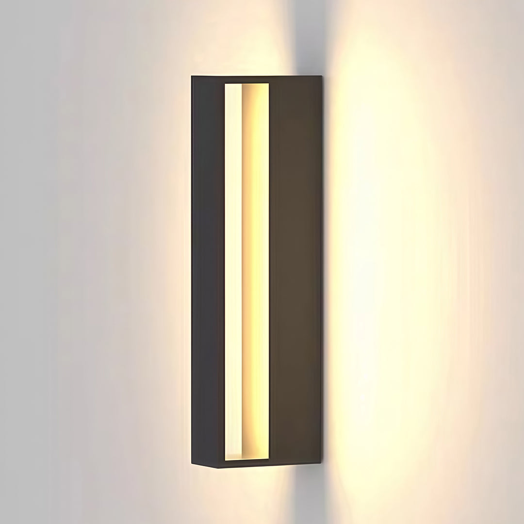 Architectural black sconces outdoor with glass shade chandelier styling creating warm ambient glow on modern facade with wall uplighting effect.