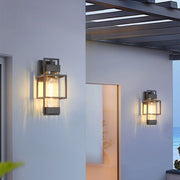 Architectural exterior featuring coordinated black wall sconces under modern covered walkway