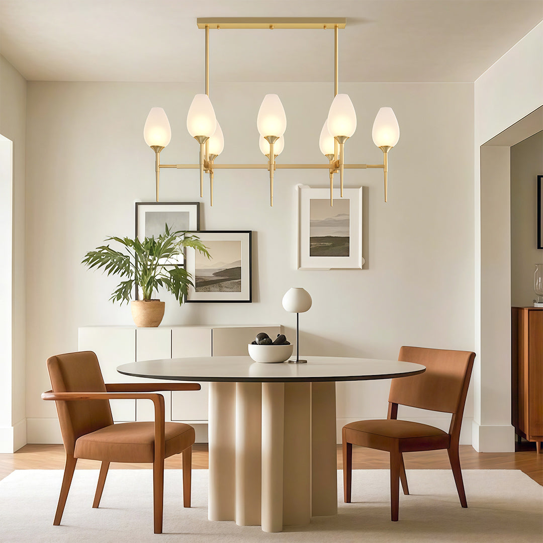 Architectural glass modern chandelier with glass shade chandelier aesthetic illuminating modern dining space with round table.