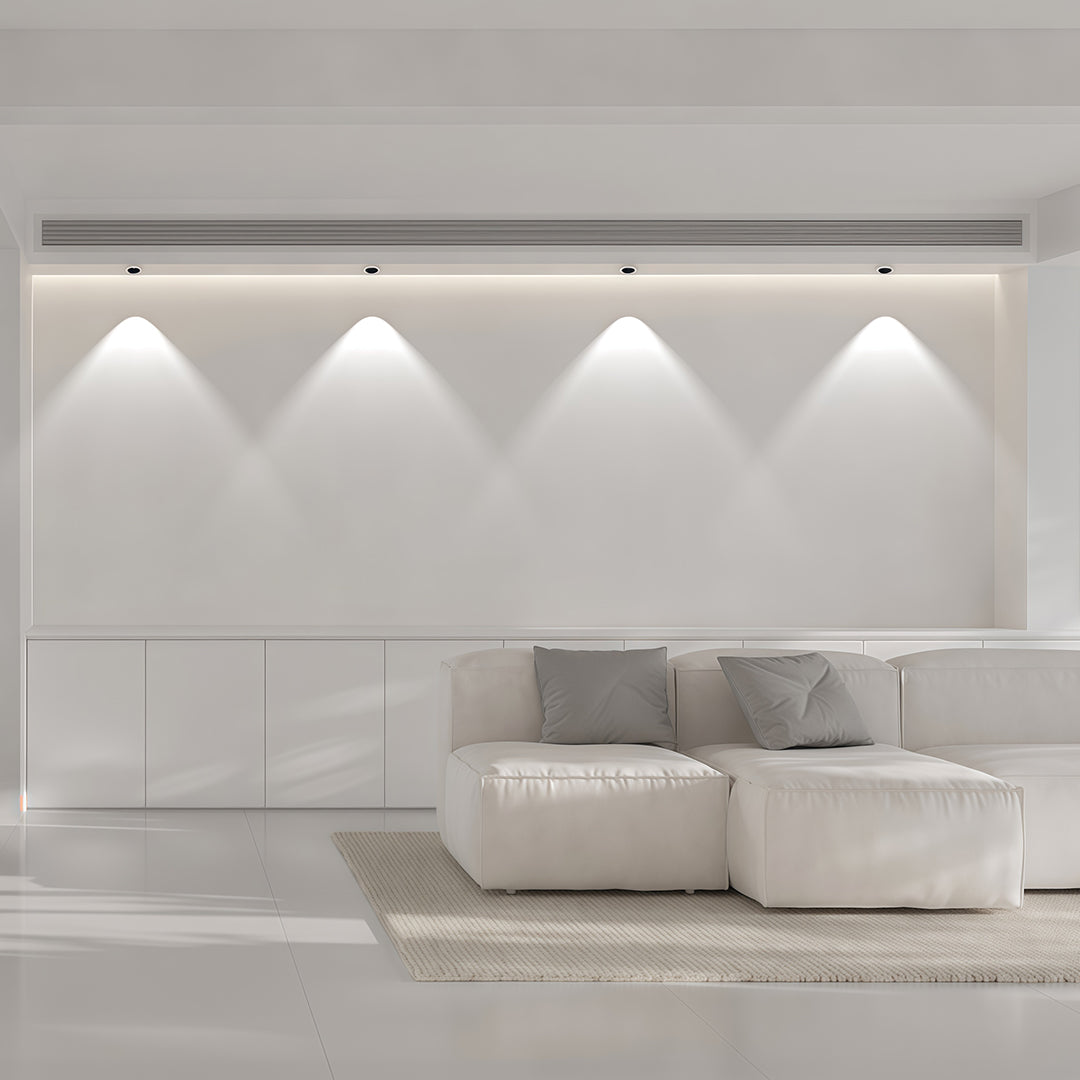 Architectural interior spotlights featuring glass shade chandelier inspired design for modern white gallery-style space.