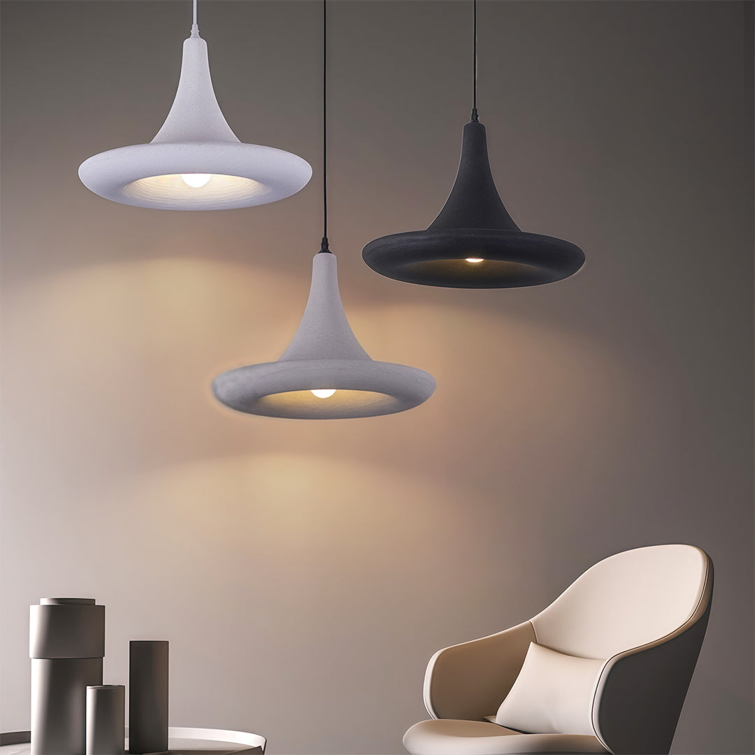 Architectural Japanese pendant light fixtures with glass shade chandelier design in mixed finishes creating ambient lighting layers.