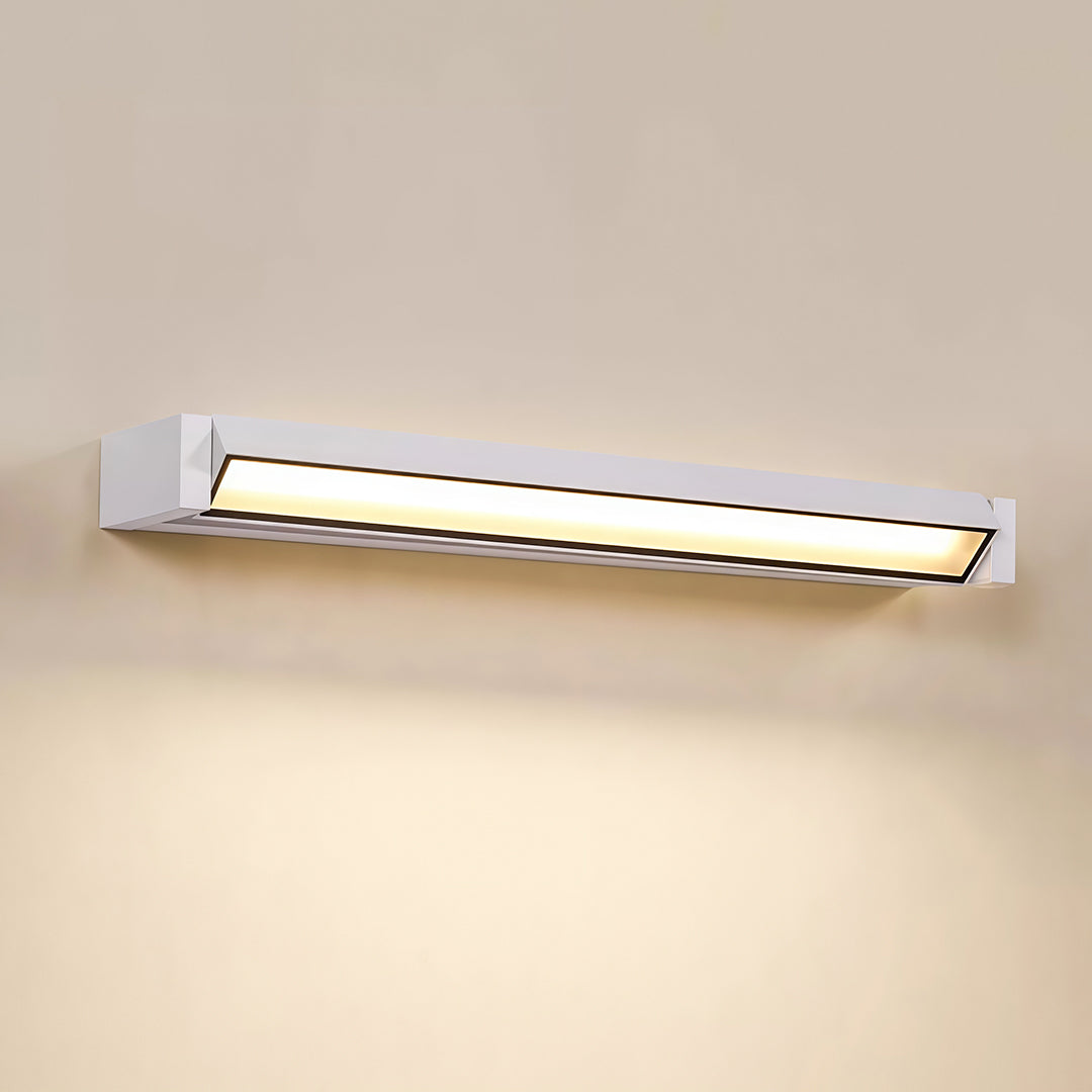 Architectural LED light bar for wall with glass shade chandelier styling creating warm downlighting on neutral wall surface.